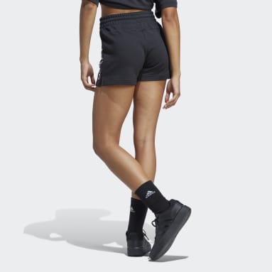 ผู้หญิง Sportswear สีดำ กางเกงขาสั้นผ้าเฟรนช์เทอร์รีย์ Essentials Linear