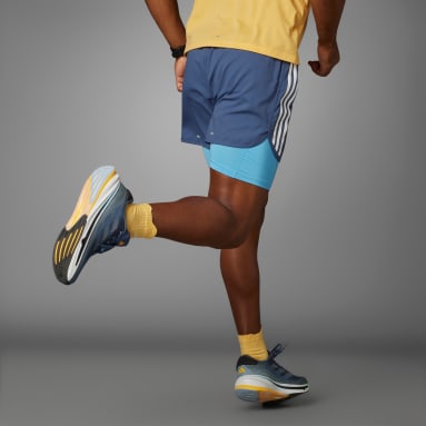 Shorts 2 em 1 Own The Run Três Listras Azul Homem Running