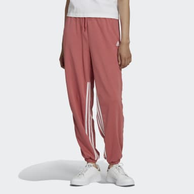 Pantalon sportswear oversize à 3 bandes avec zips latéraux et chevilles resserrées Hyperglam Rouge Femmes Sportswear