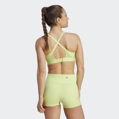 A woman in a neon green sports bra top Image & Design ID 0000380294 