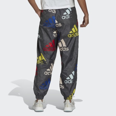 Women Sportswear Essentials Multi-Colored Logo Loose Fit Woven Tracksuit Bottoms