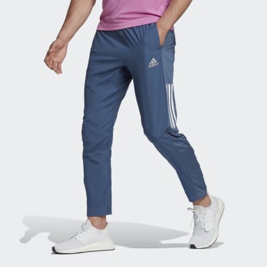 Men Running Blue adidas Own The Run Astro Wind Pants