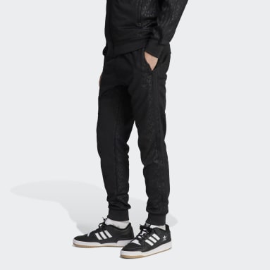 Nike Sportswear Pantalones deportivos - black/negro 
