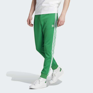 adidas Originals SUPERSTAR - Tracksuit bottoms - green/dark green 