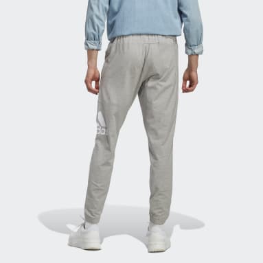 Pantalon fuselé en jersey Essentials Badge of Sport gris Hommes Sportswear