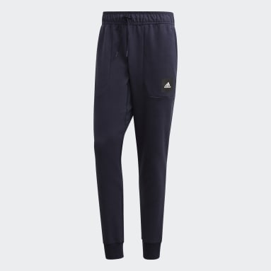 Muži Sportswear modrá Kalhoty Must Haves Stadium