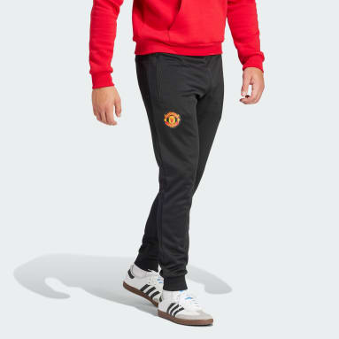 Spodnie dresowe Manchester United Essentials Trefoil Czerń