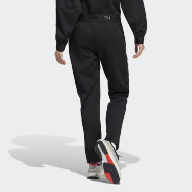 Ženy Sportswear černá Sportovní kalhoty Tiro Suit-Up Advanced