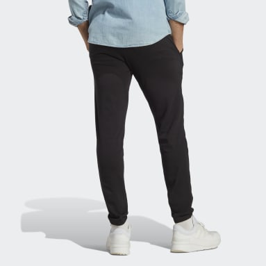 Pantalon fuselé élastique en jersey avec logo Essentials Noir Hommes Sportswear