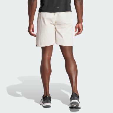 Free Shipping $99+  Shorts rosa luminoso de adidas Training