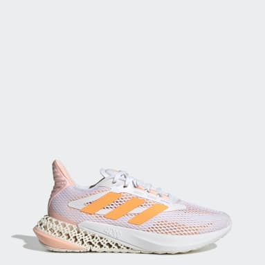 white adidas shoes with colorful bottoms