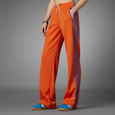Ženy Originals oranžová Sportovní kalhoty Adicolor 70s Montreal