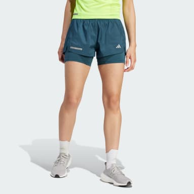 ผู้หญิง วิ่ง สีเทอร์คอยส์ กางเกงขาสั้นดีไซน์ทูอินวัน Ultimate