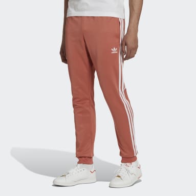 Muži Originals hnedá Tepláky Adicolor Classics Primeblue SST