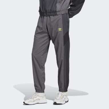 ผู้ชาย Originals สีเทา กางเกงแทรคผ้าทอ adidas Rekive