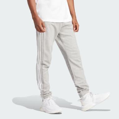 Pantalón Essentials French Terry Tapered Elastic Cuff 3 bandas Gris Hombre Sportswear