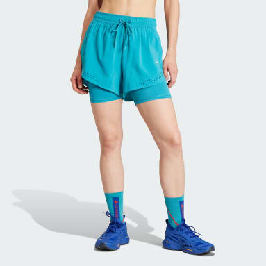 ผู้หญิง adidas by Stella McCartney สีเทอร์คอยส์ กางเกงเทรนนิงขาสั้นดีไซน์ทูอินวัน adidas by Stella McCartney TruePurpose