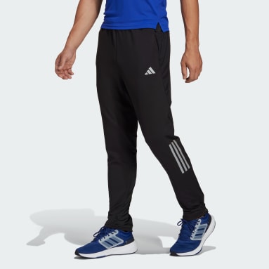 Muži Beh čierna Tepláky Own the Run Astro Knit