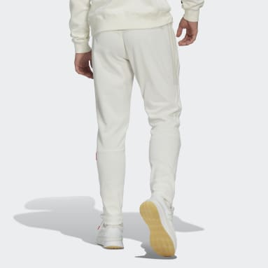 ผู้ชาย Sportswear สีขาว กางเกงขายาวจั๊มปลายขา 3-Stripes