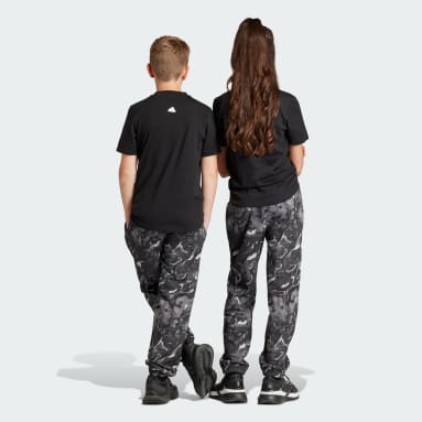 Kinder Sportswear Future Icons Allover Print Kids Hose Grau