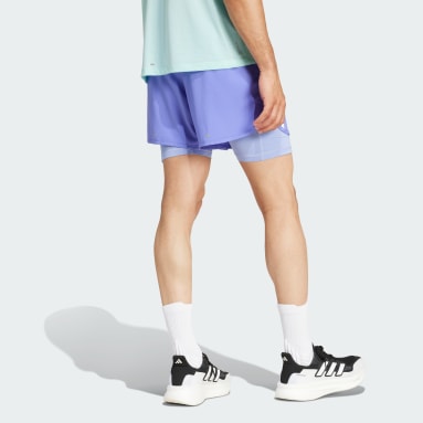 Shorts 2 em 1 Own the Run Três Listras
