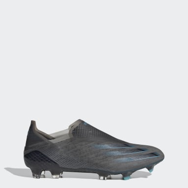 gold laceless football boots