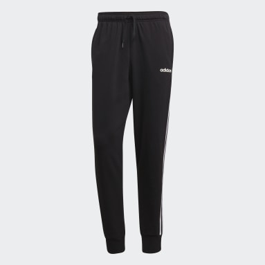 Muži Sportswear čierna Tepláky Essentials 3-Stripes Tapered Cuffed