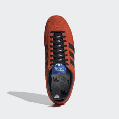 orange and black adidas trainers