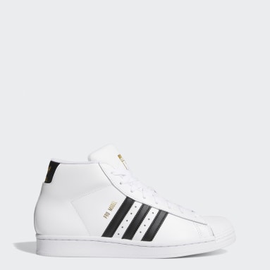 black and white adidas shoes high tops