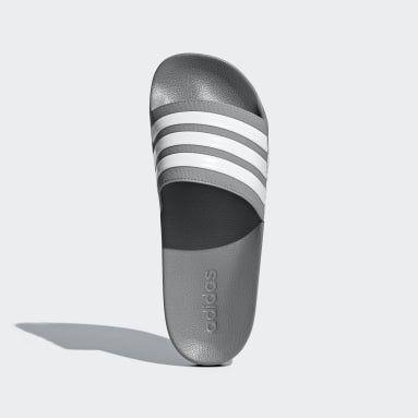 grey and white adidas slides