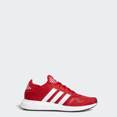 red adidas shoes with black stripes