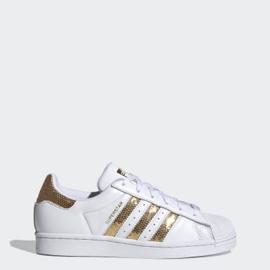 white and gold shell toe adidas