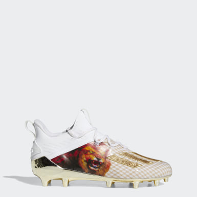 gold and white adidas football cleats