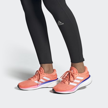 Orange sports clearance shoes