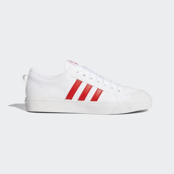 white adidas with red stripes