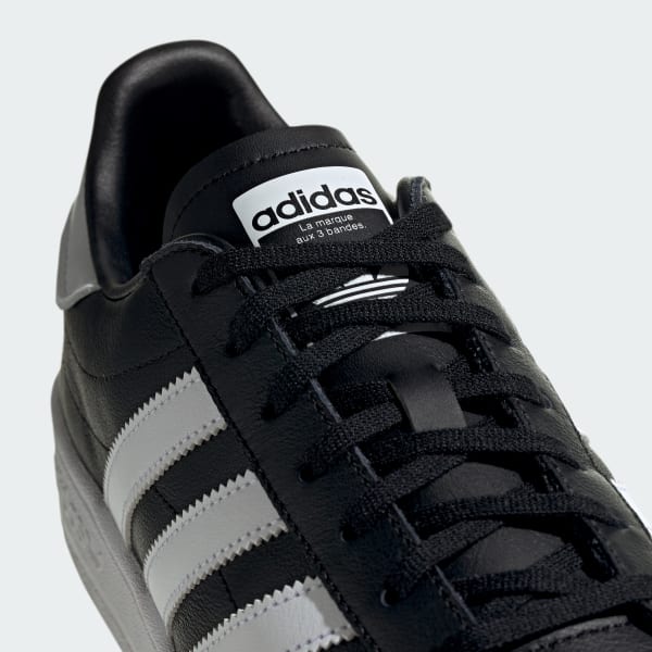 Zwarte en witte Team Court schoenen | adidas Nederland