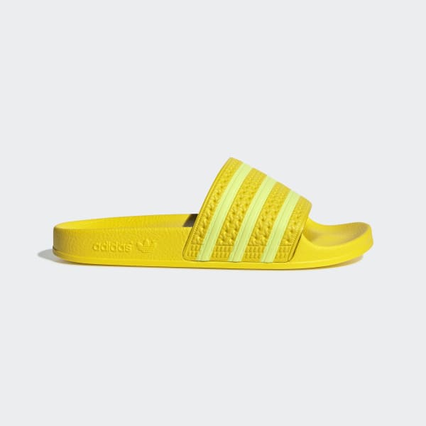 yellow adidas flip flops