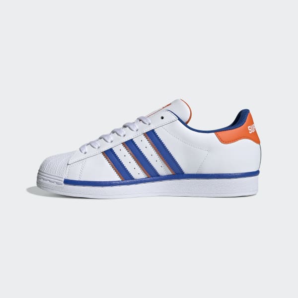 blue and white adidas shell toes
