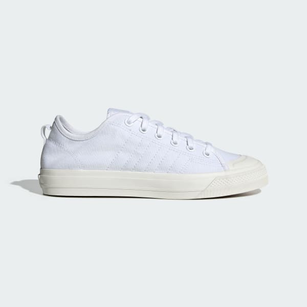 white canvas adidas trainers