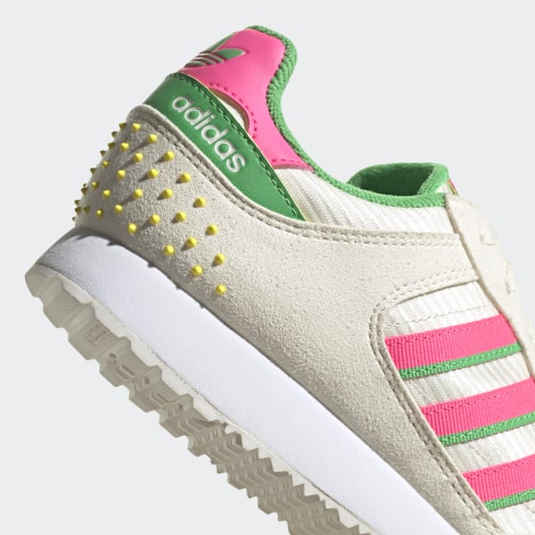 green and white adidas trainers