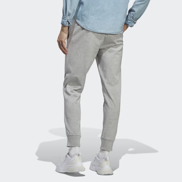 adidas Essentials Fleece Tapered Cuff Logo Pants Navy These pants are ultra  cozy and have sporty style that's undeniable. An oversize adidas Badge of  Sport and cuffed hems add to a fashion-forward