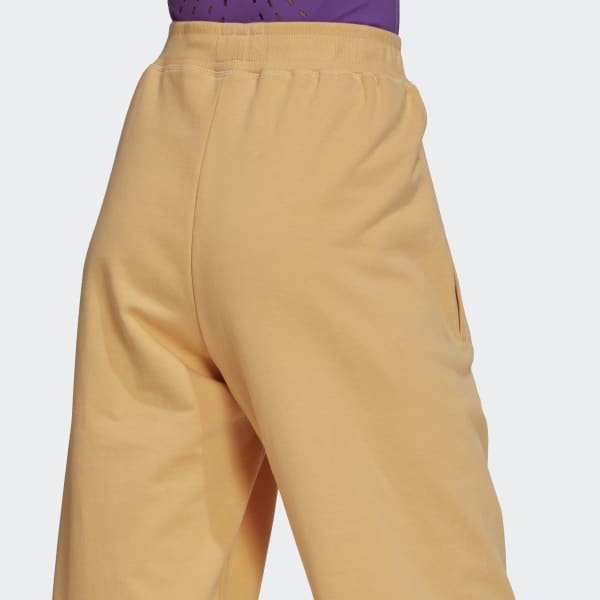 zlutá Sportovní kalhoty adidas by Stella McCartney Sportswear (UNISEX) BWC70