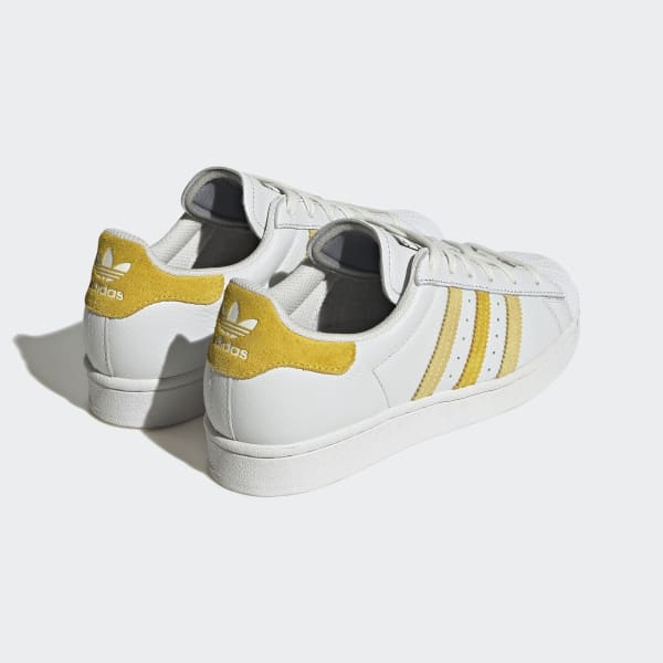 Adidas superstar yellow outlet stripe