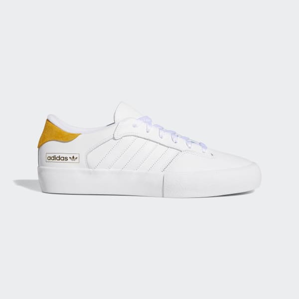 white and yellow adidas shoes