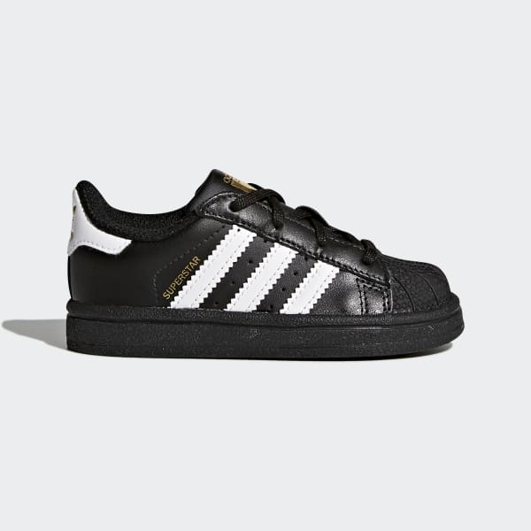 white and black adidas superstar