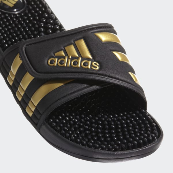 black and gold adidas slides