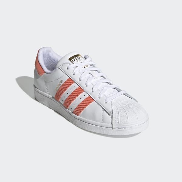 orange and white adidas shoes