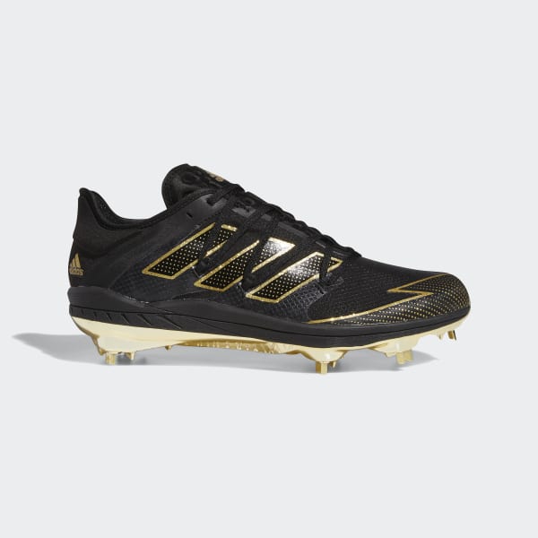 gold and black baseball cleats
