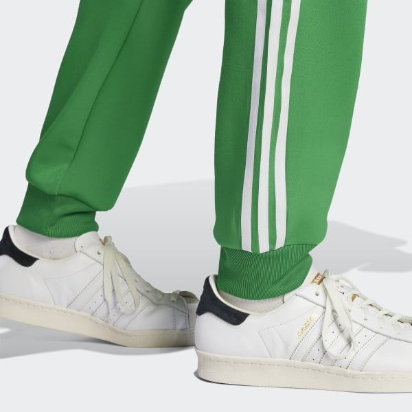 Mens green adidas sst track pants sale