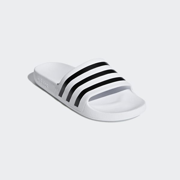 white and black adidas slides